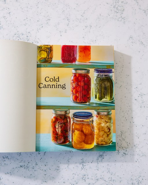 Cold Canning book open to title page depicting jars of fruits and vegetables
